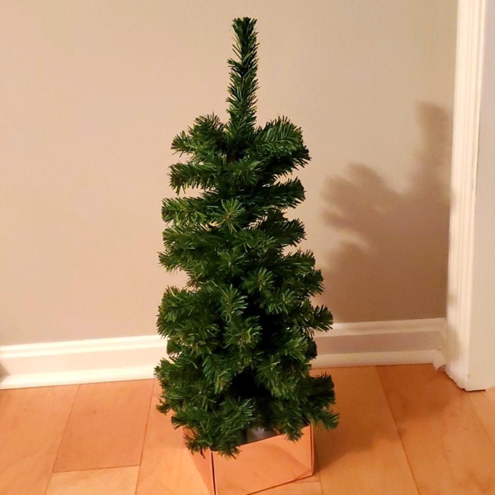Small tabletop Christmas tree with concrete base
